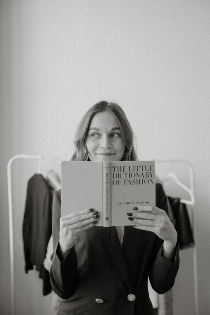 Liz reading "The Little Dictionary of Fashion"